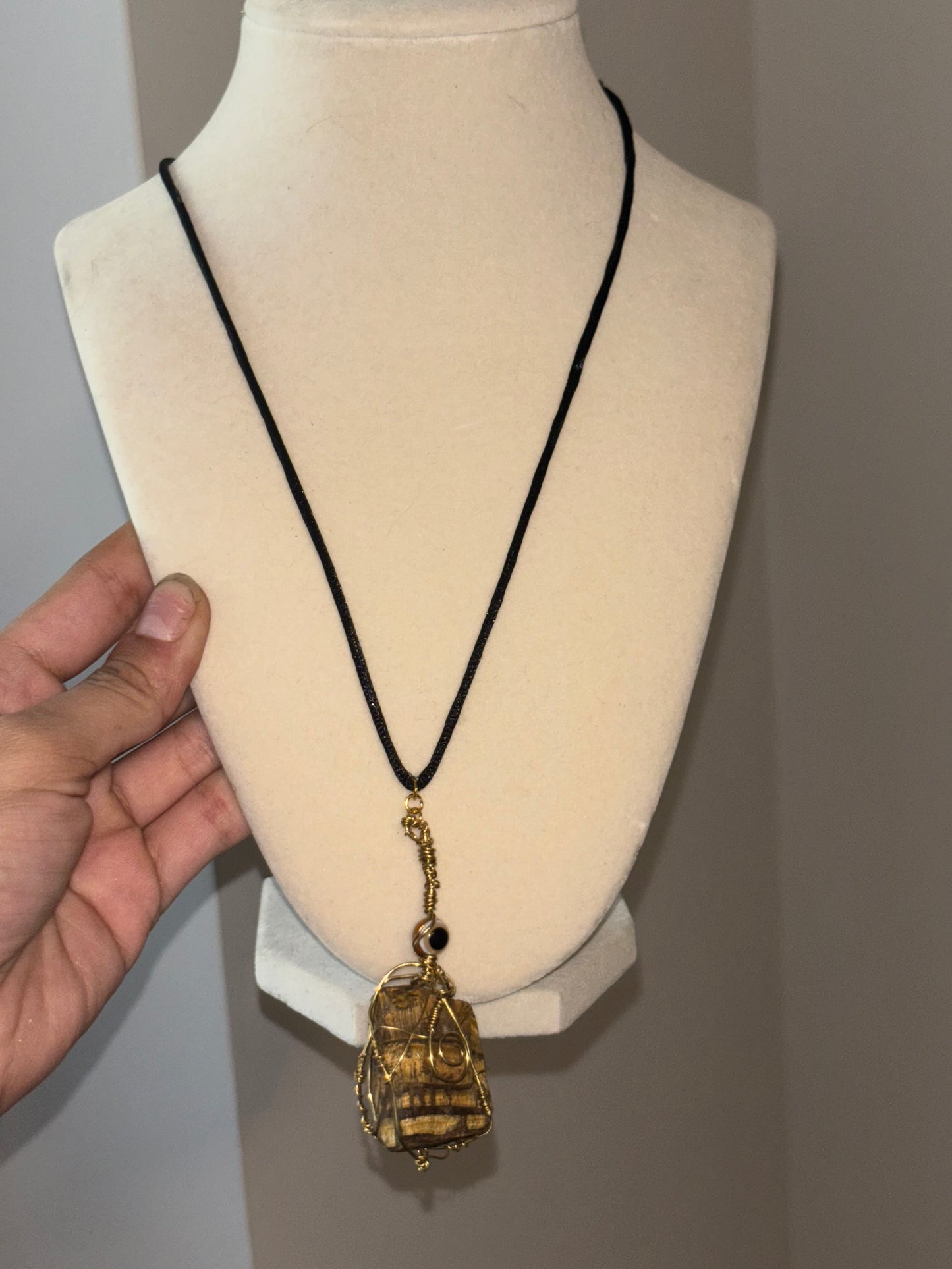 Raw tigers eye with Brown Nazar Charm wired wrapped in color gold